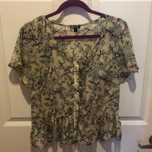 Summer top with ruffles and cute button detail